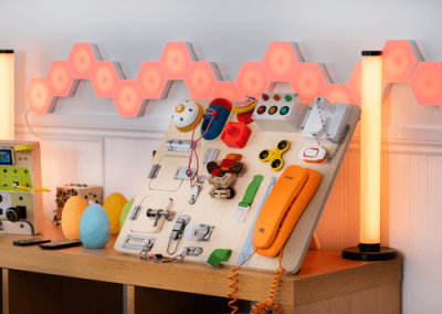 Outdoor garden area with pergola seating, landscaped borders and accessible paved paths for residents.