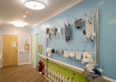 Sensory space featuring baby clothes and tactile displays to encourage reminiscence and meaningful engagement.